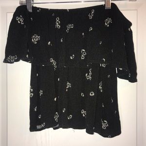 Black off the shoulder top with white flowers